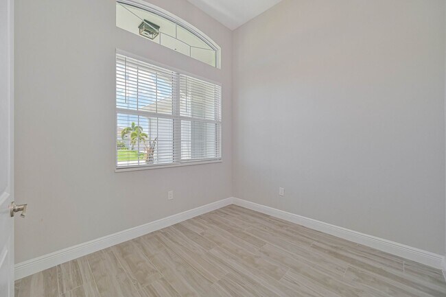 Building Photo - NOW AVAILABLE - Gorgeous Pool Home ~ NW Cape ~ 3 Car Garage ~ On Canal!
