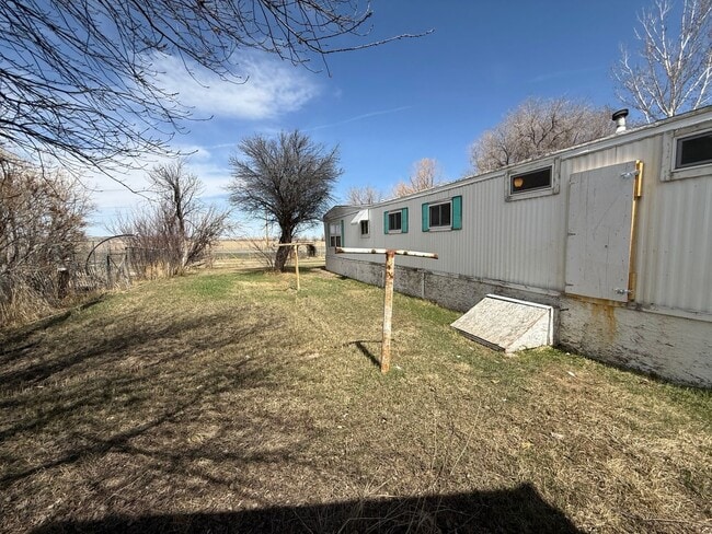 Building Photo - 2 Bedroom 1.5 Semi-Rural Mobile Home with Workshop on Large Lot