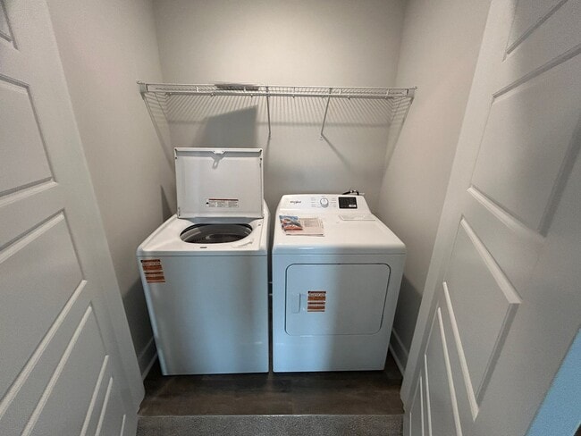 Building Photo - Welcome to this brand new end unit townhome that combines modern convenience with style and charm...