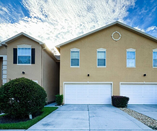 Building Photo - Gated Tampa Palms Townhome with 2-Car Garage, Screened Lanai & Community Pool