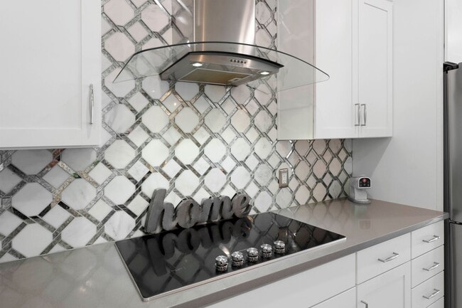 Building Photo - Introducing a captivating 3-story townhome...