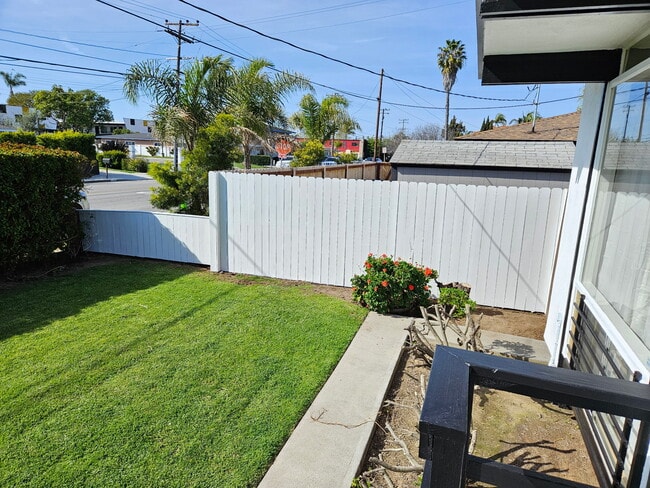 Side fence in front of apartment - 1944 Maple Ave