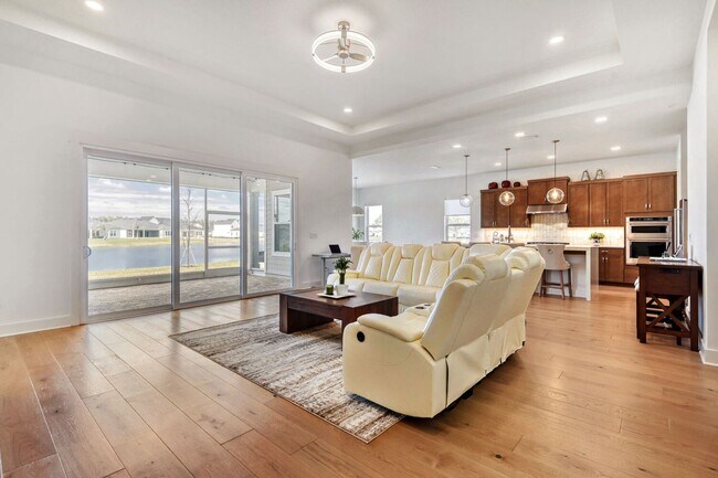 Building Photo - Resort-Style Furnished Lakefront Living in SilverLeaf | 100” Theater & Golf Cart Included