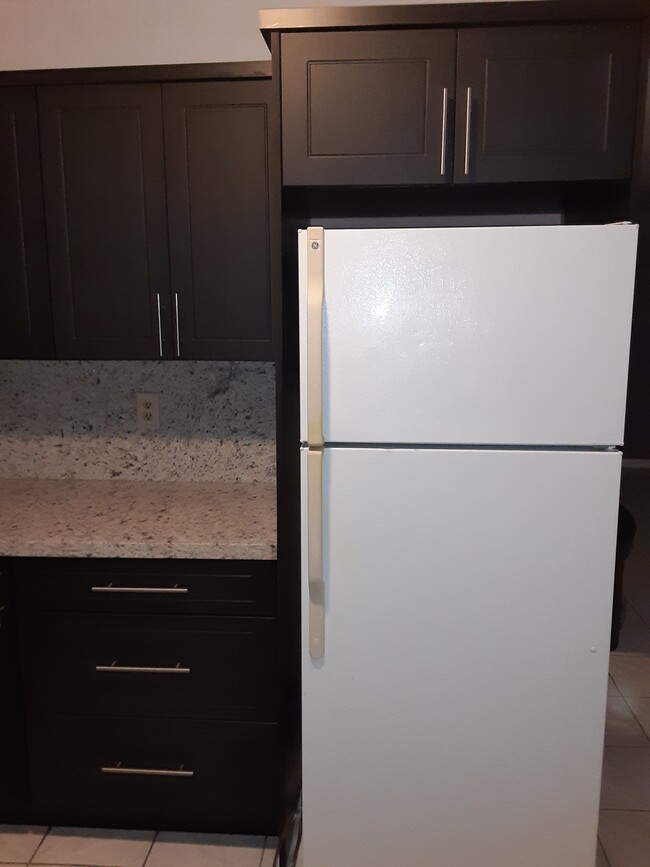 New refrigerator will be bought and installed once lease is signed. - 1900 Plunkett St