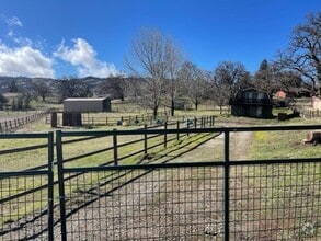 Building Photo - Completely Furnished - WITH FENCED CORRAL...