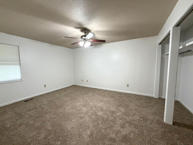 Building Photo - 2 Bedroom 1 Bath Duplex with garage/basement, side porch, and carport.