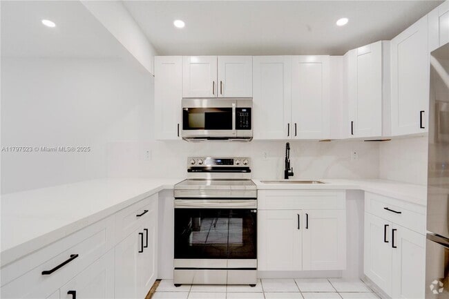 Building Photo - 6095 W 18th Ave