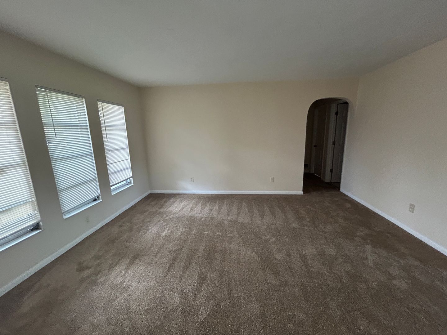 Building Photo - Freshly painted interior and new carpet in living room spacious home off Country Club Blvd
