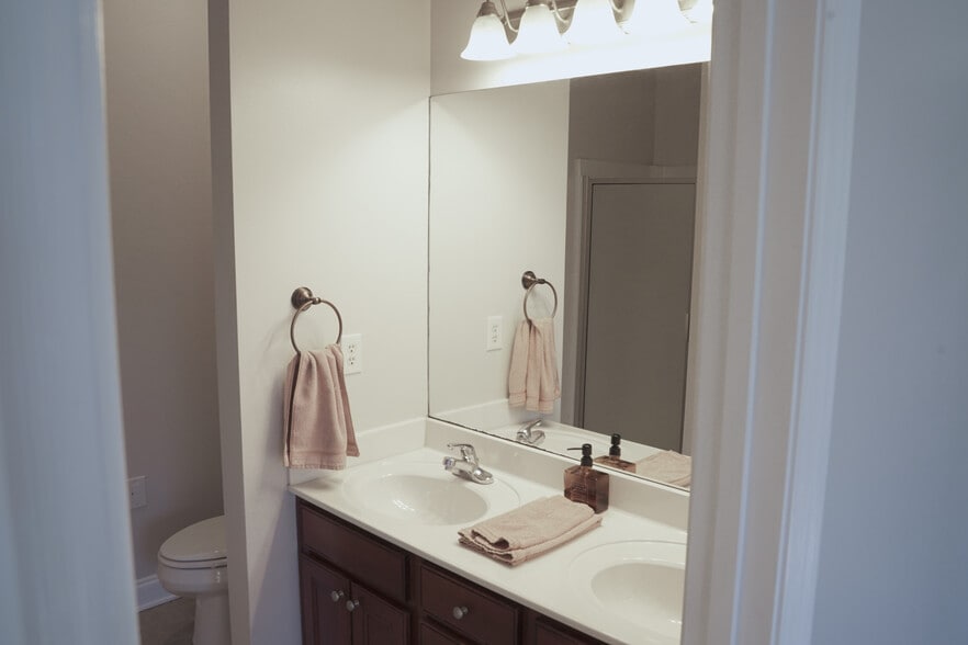 Primary Bath With Double Sinks, toilet, shower and Jet tub. (9x8) - 393 Hays Blvd