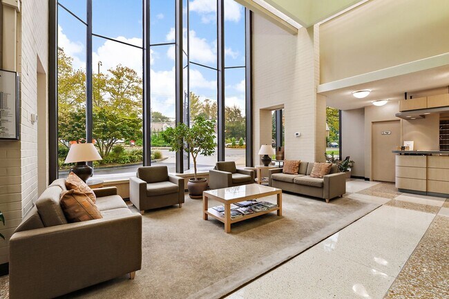 Building Photo - Spacious, and Sunlit 1 BD/1 BA Condo w/Reserved Garage Parking and Utilities Included in Chevy Ch...