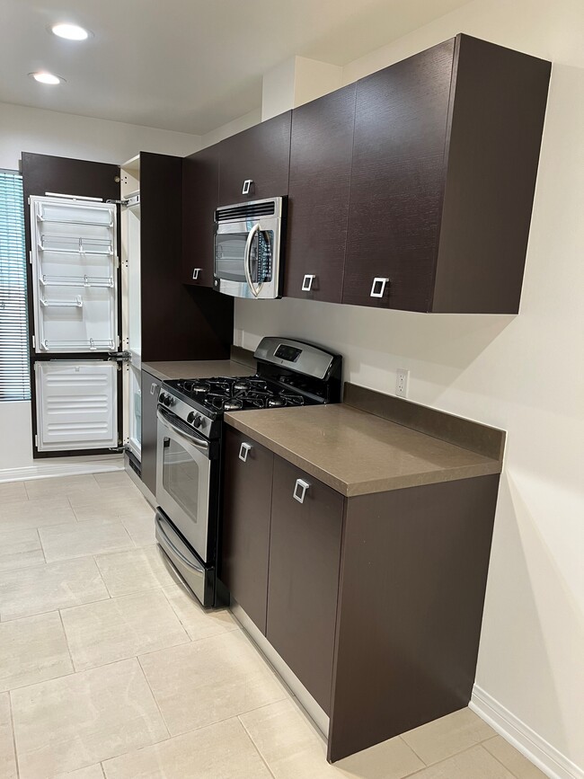 kitchen showing hidden refrigerator - 1418 N Poinsettia Pl