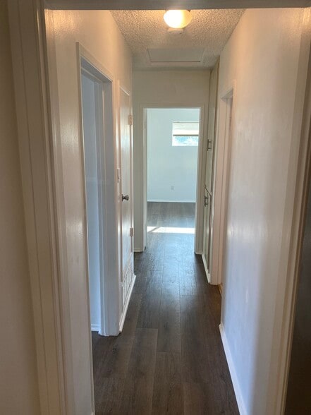 Hallway with built in linen closet on right side - 6716 Pollard St
