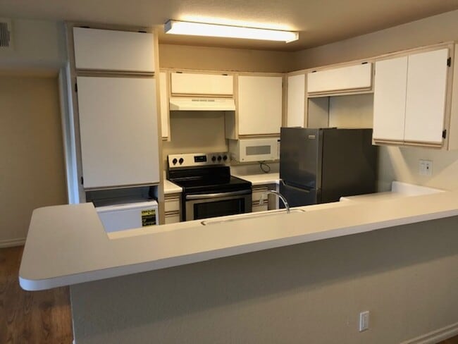 Building Photo - 1 Bedroom Luxury Living . . .  with 2 gated parking spots