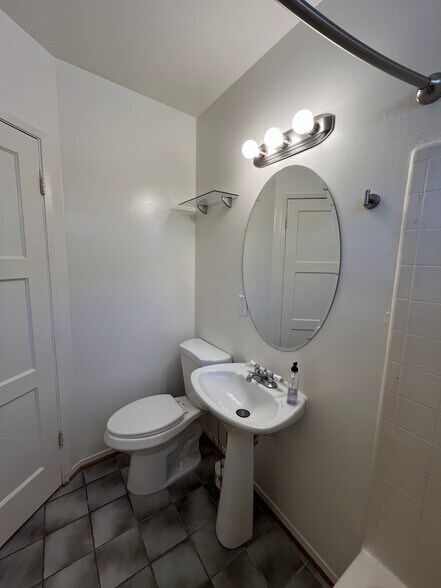 Bathroom toilet and pedestal sink - 256 17th St
