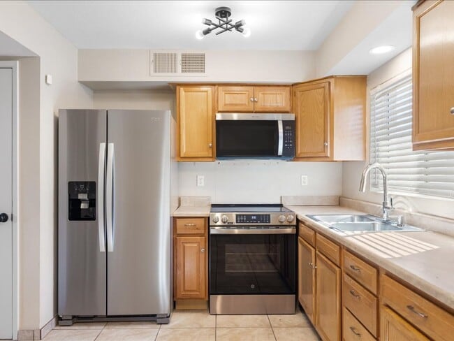 Building Photo - Two-Story Home with Brand New Appliances & Private Turf Backyard!