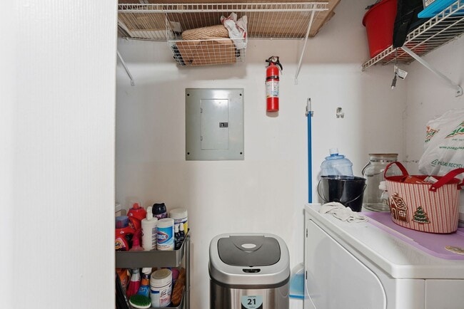 Building Photo - Bathed in natural light, this stunning second level condominium offers an effortless blend of com...