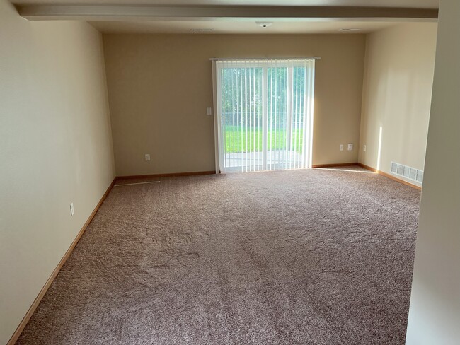 lower level family room facing patio doors - 1480 Palisades Dr