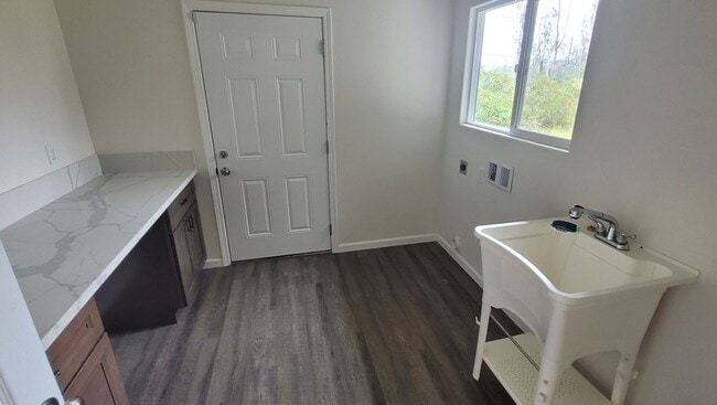 Building Photo - This 3-bedroom, 2-bath home in Orchidland Subdivision