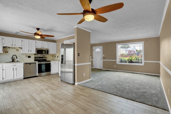 Building Photo - Spacious 4-Level Home with Deck, Workshop ...