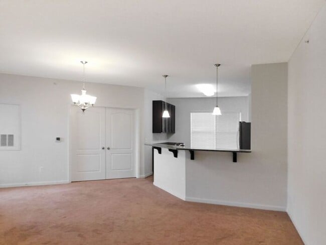 Building Photo - Pet Friendly Condo with Deck and 1 Car Garage