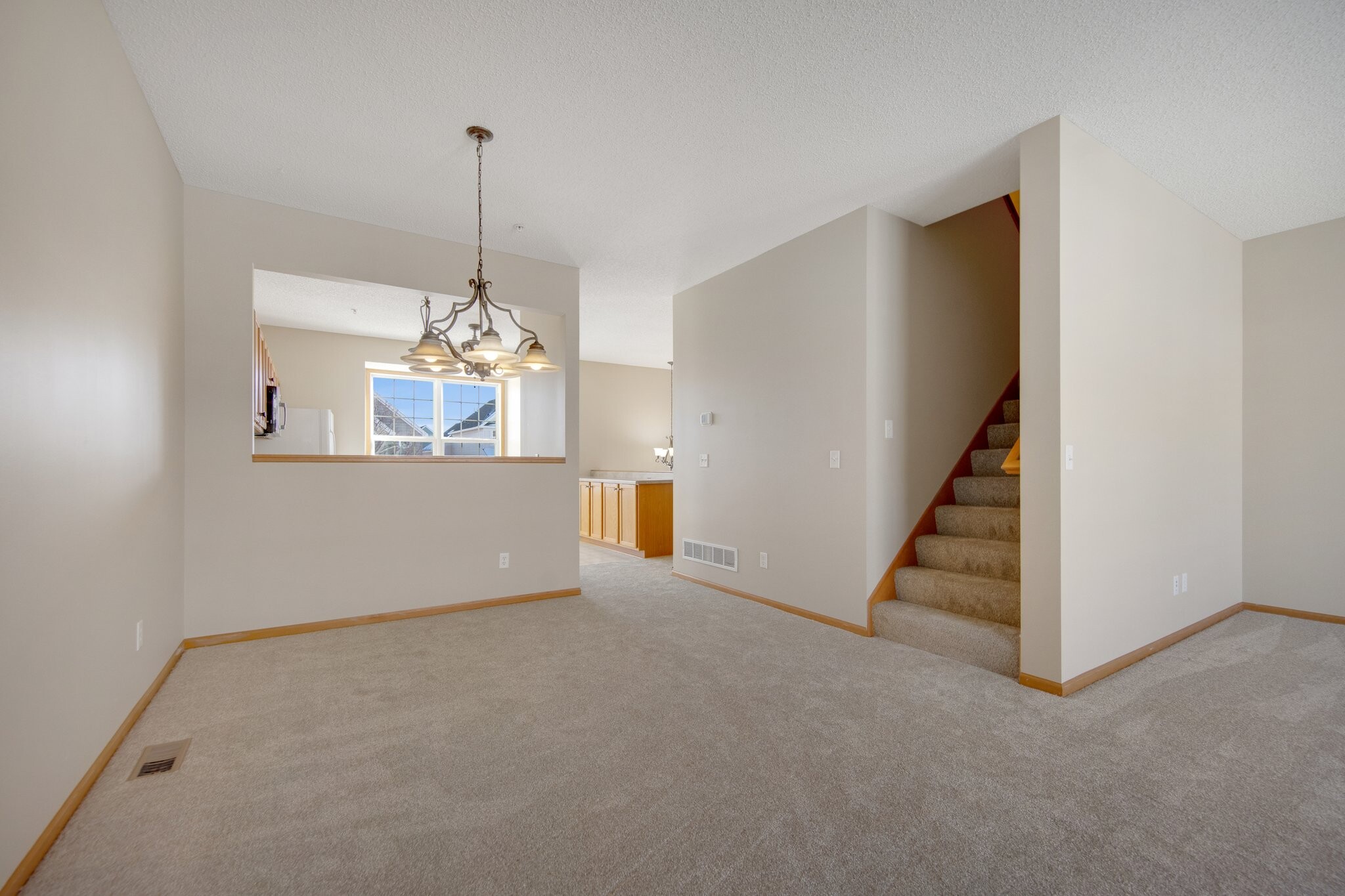 Dining Room with the Kitchen in the background - 10022 Gentian Dr