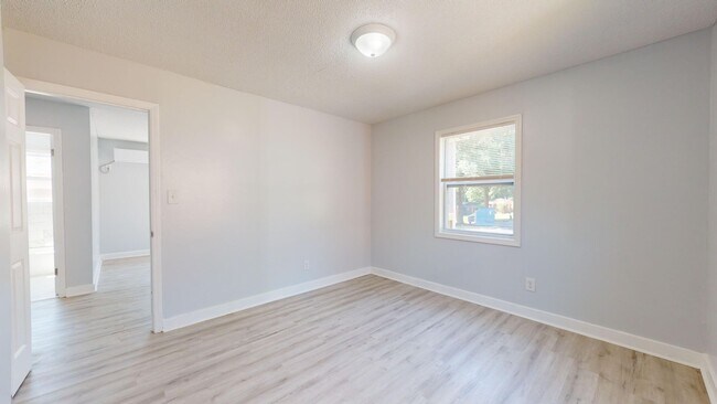 Building Photo - Two bedroom apartment for $1199 per month ~5 minutes from the Airport in a quaint and quiet commu...