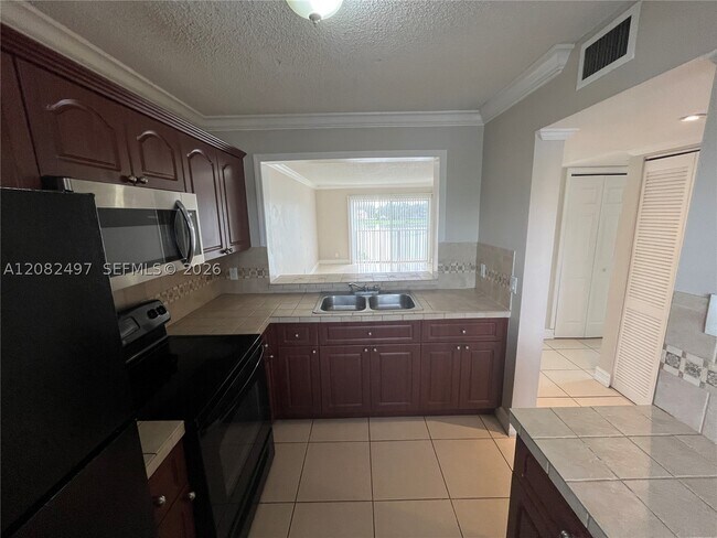 Building Photo - 8560 N Sherman Cir