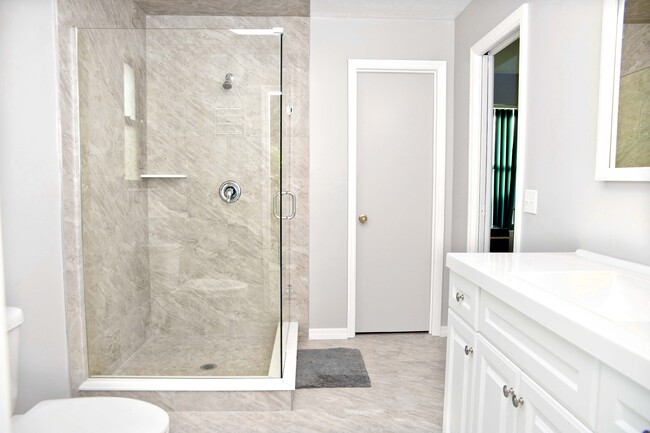 Master Bathroom with glass shower enclosure - 722 SE Thanksgiving Ave