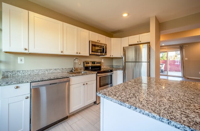 Building Photo - Spacious 3-Level Townhouse with Finished Basement and Fenced Patio