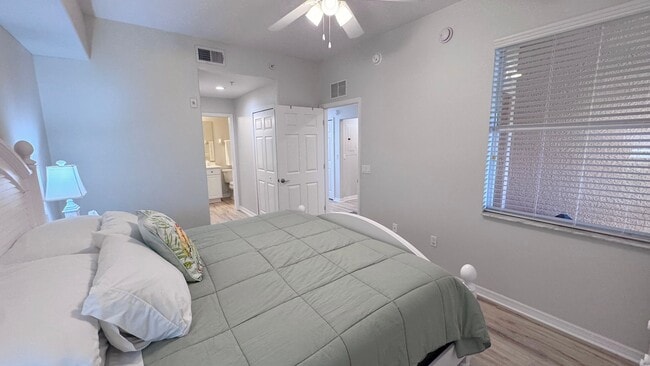 Building Photo - Elevated Luxury at The Terraces – 4th Floor Lake & Golf Course Views! 55+ Community!