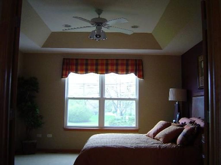 Master Bedroom with trey ceiling and beautiful views of the fox. - 281 Hickory Lane