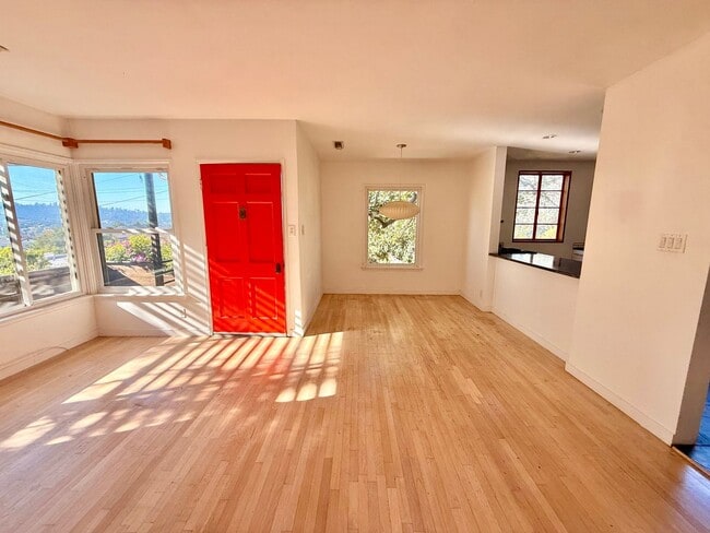 Building Photo - Hilltop Highland Park Sanctuary with Views, Private Gated Yard, In Unit Laundry, Parking & Abunda...