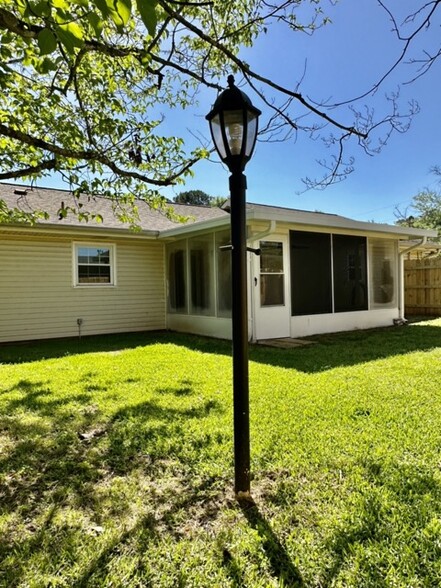 Back of house with screened in patio - 101 Williams Dr