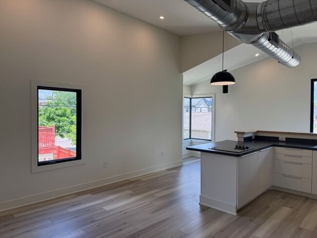 Building Photo - Vaulted Ceilings & Hardwood Floors in This Charming Indianapolis L