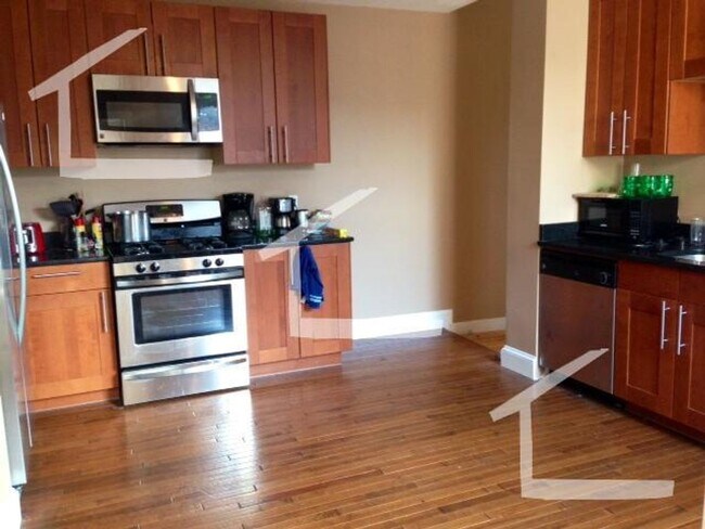 Building Photo - Large 5 bedroom, 2 full baths, right on the T!