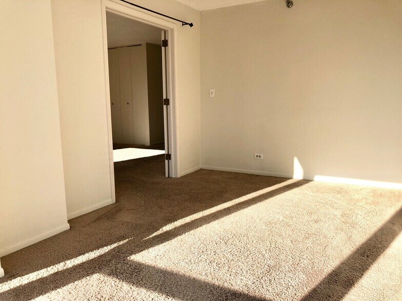 Bedroom looking out into the living room. - 1122 N Clark St