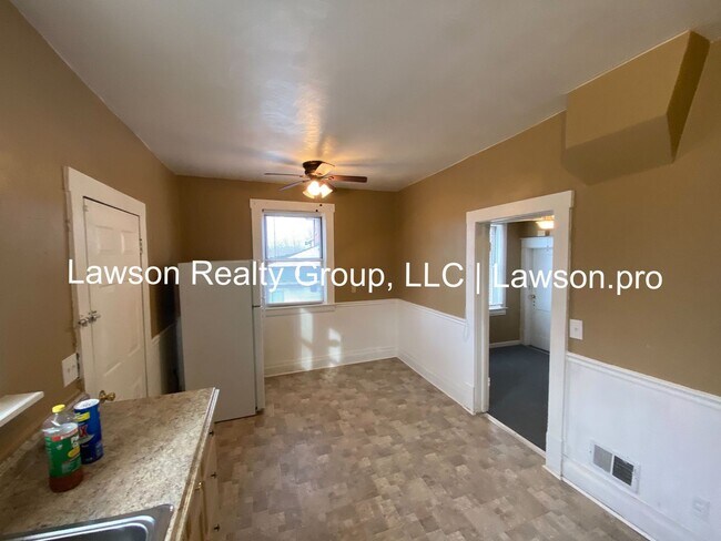 Building Photo - Updated Three Bedroom with Flat Yard