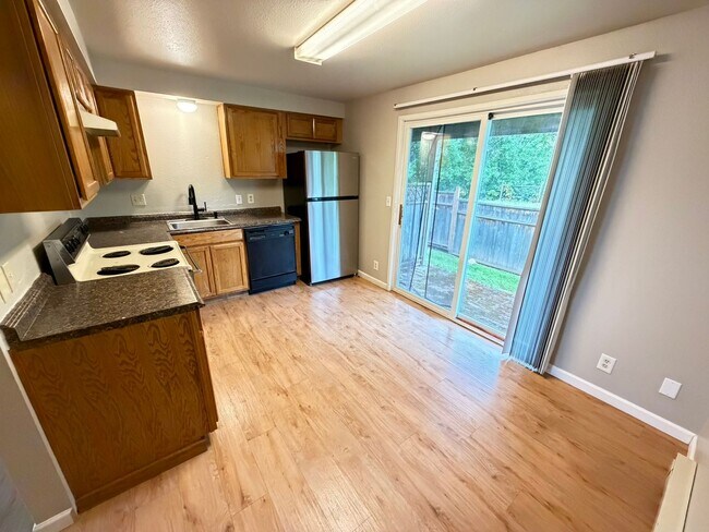 Building Photo - Update Two Bedroom on the First Floor with Covered back patio!