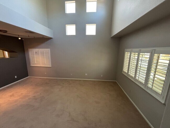 Building Photo - Gated Green Valley Ranch Townhome | 2 Bed | 2.5 Bath | 2-Car Garage