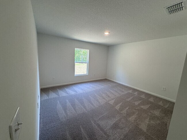 Building Photo - "Charming 4-Bedroom Home in Spring Hill, F...