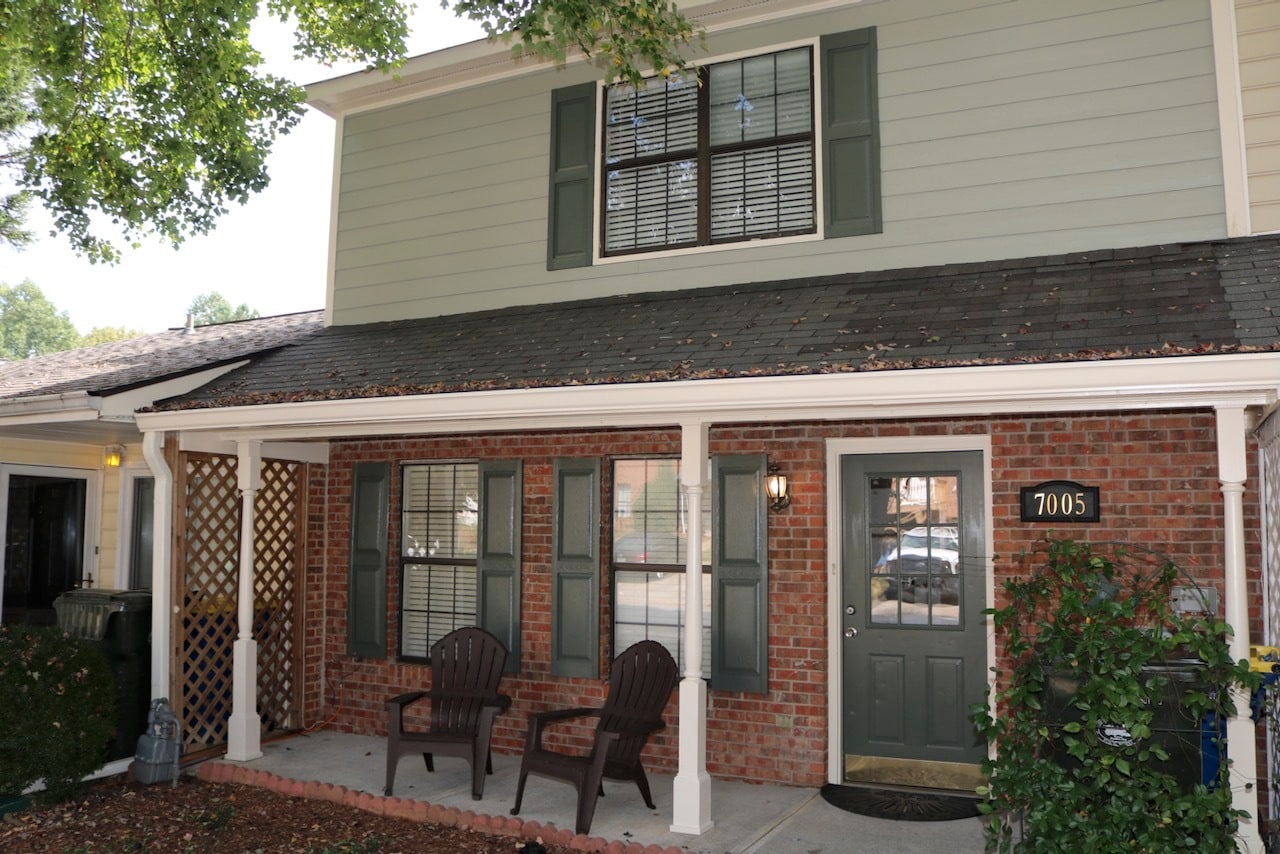 Freshly painted exterior with covered porch. - 7005 Sand Wedge Cir