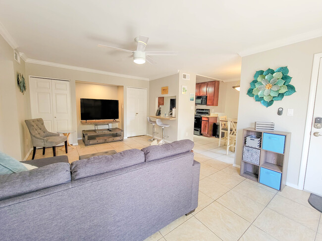 The main living area features a large flat-screen Smart TV with HDMI capabilities. - 3500 N Hayden Rd