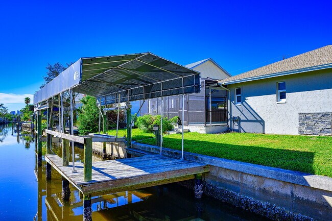 Building Photo - Waterfront Furnished Pool Home with Gulf & Canal Views in Estero Bay Shores