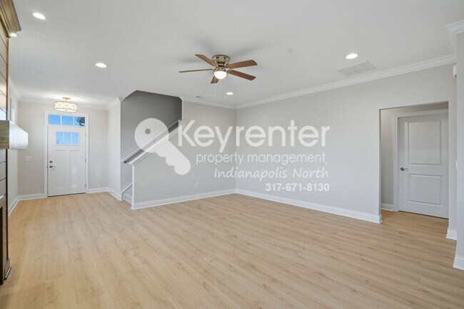 Building Photo - Located in Westfield, IN, this attractive 3-bedroom, 2.5-bath home sits on a corner lot within an...