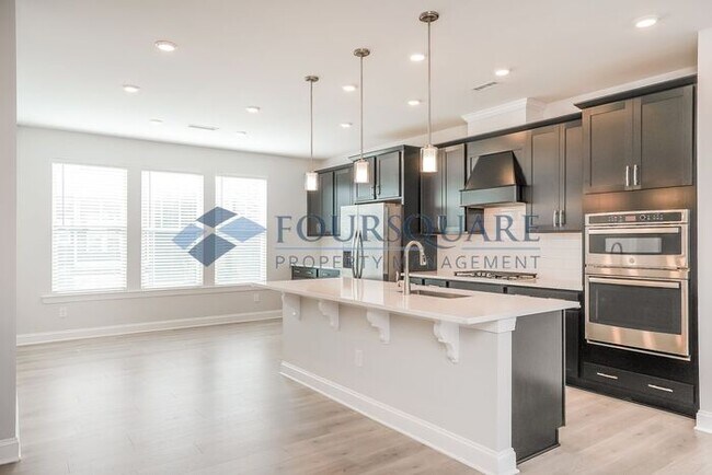 Building Photo - Spacious  End-Unit Townhome | Rear Deck & 2-Car Garage  | Near Brier Creek