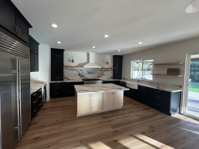 Kitchen with new cabinets and gorgeous quartz countertops and backsplash - 34189 Hourglass St