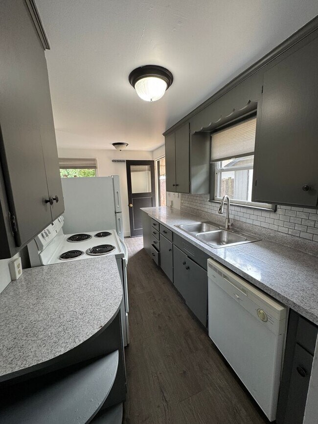 Building Photo - Spacious Two Story (2BR/1BA) Home with Large Fenced-In Yard