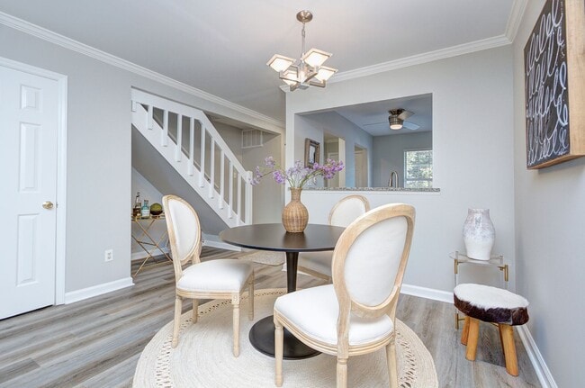 Building Photo - Discover this beautifully updated Raintree townhome featuring an open floor plan and a range of c...