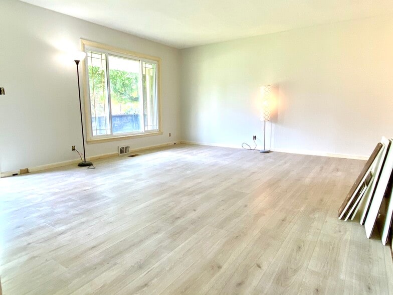 Spacious living room, all trim work to be complete in June - 8003 Broadfern Dr
