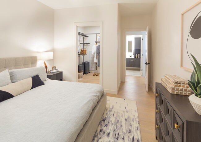 Indulge in comfort and organization with a spacious bedroom and ample closet space - Modera Cherry Creek